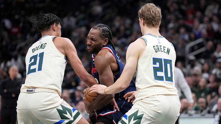 Mar 29, 2026; Milwaukee, Wisconsin, USA; LA Clippers forward Kawhi Leonard (2) is tied up by Milwaukee Bucks forward Ousmane Dieng (21) in the first half at Fiserv Forum. Mandatory Credit: Michael McLoone-Imagn Images