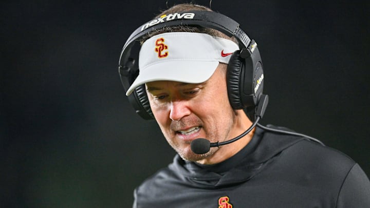 Oct 14, 2023; South Bend, Indiana, USA; USC Trojans head coach Lincoln Riley talks on his headset in the third quarter against the Notre Dame Fighting Irish at Notre Dame Stadium. Mandatory Credit: Matt Cashore-Imagn Images Oct 14, 2023; South Bend, Indiana, USA; USC Trojans head coach Lincoln Riley talks on his headset in the third quarter against the Notre Dame Fighting Irish at Notre Dame Stadium. Mandatory Credit: Matt Cashore-Imagn Images