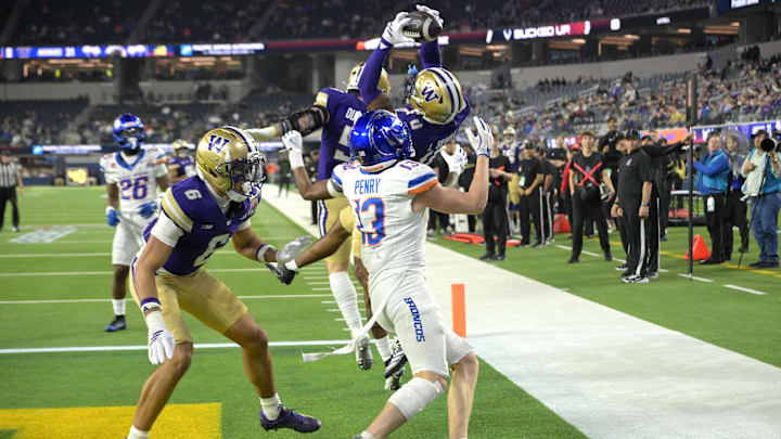 Washington cornerback Leroy Bryant intercepts a pass intended for Boise State's Chase Penry. Washington cornerback Leroy Bryant intercepts a pass intended for Boise State's Chase Penry.