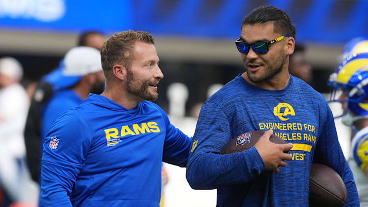 Aug 16, 2025; Inglewood, California, USA; Los Angeles Rams coach Sean McVay (left) talks with wide receiver Puka Nacua (12) against the Los Angeles Chargers in the first half at SoFi Stadium. Mandatory Credit: Kirby Lee-Imagn Images