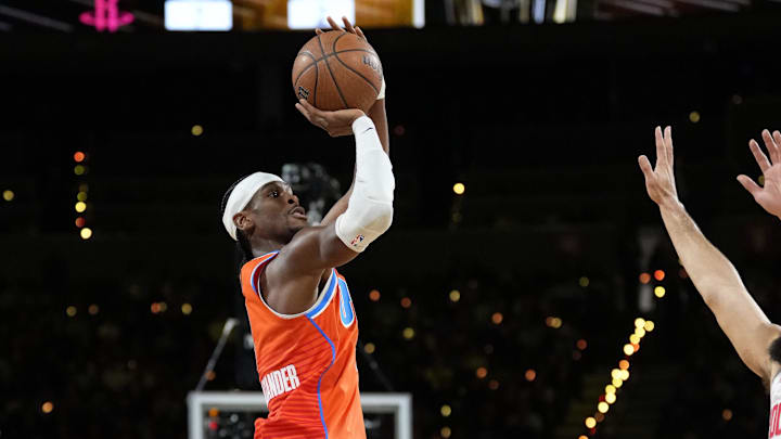 Dec 14, 2024; Las Vegas, Nevada, USA; Oklahoma City Thunder guard Shai Gilgeous-Alexander (2) shoots against the Houston Rockets during the first quarter in a semifinal of the 2024 Emirates NBA Cup at T-Mobile Arena.