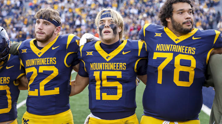 Nov 8, 2025; Morgantown, West Virginia, USA; West Virginia Mountaineers quarterback Scotty Fox Jr. (15) sings “Country Roads” after defeating the Colorado Buffaloes at Milan Puskar Stadium. Mandatory Credit: Ben Queen-Imagn Images