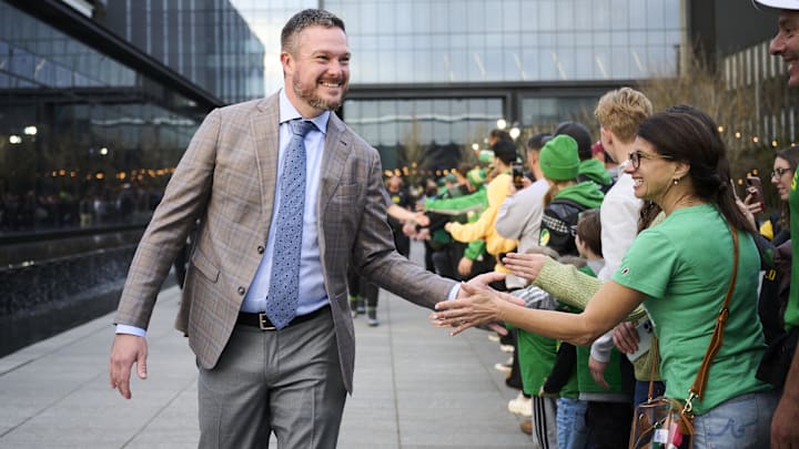 Nov 14, 2025; Eugene, Oregon, USA; Oregon Ducks head coach Dan Lanning high fives fans before a game between the Oregon Ducks and the Minnesota Golden Gophers at Autzen Stadium. Mandatory Credit: Troy Wayrynen-Imagn Images