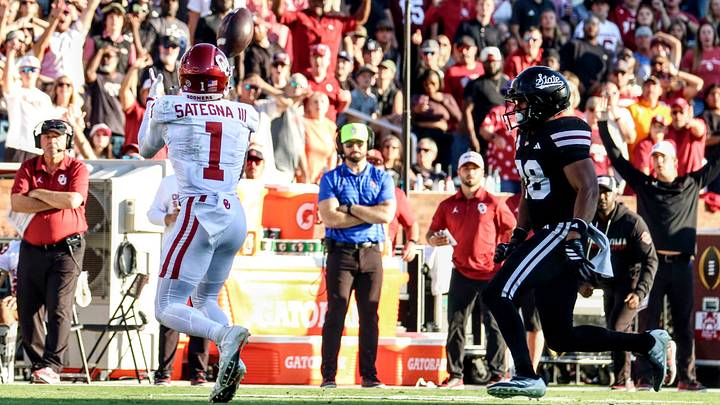 Oklahoma wide receiver Isaiah Sategna catches a deep ball against Mississippi State. Oklahoma wide receiver Isaiah Sategna catches a deep ball against Mississippi State.