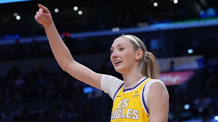 LA Sparks forward Cameron Brink (22) reacts to the fans after blocking a shot by Indiana Fever forward Damiris Dantas (12) in the second half at Crypto.com Arena.