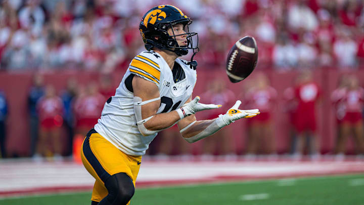 Oct 11, 2025; Madison, Wisconsin, USA; Iowa Hawkeyes wide receiver Kaden Wetjen (21) receives the opening kickoff against the Wisconsin Badgers at Camp Randall Stadium. Mandatory Credit: Ross Harried-Imagn Images Oct 11, 2025; Madison, Wisconsin, USA; Iowa Hawkeyes wide receiver Kaden Wetjen (21) receives the opening kickoff against the Wisconsin Badgers at Camp Randall Stadium. Mandatory Credit: Ross Harried-Imagn Images