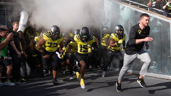Oregon coach Dan Lanning leads his team onto the field for their game against Illinois at Autzen Stadium in Eugene on Saturday, Oct 26, 2024.