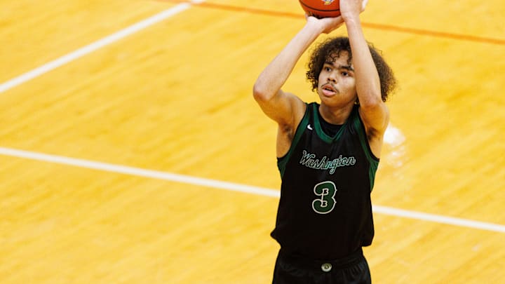 Washington's Steven Reynolds III shoots a free throw during an IHSAA 3A Sectional boys basketball game.