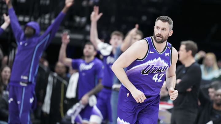 Mar 9, 2026; Salt Lake City, Utah, USA; Utah Jazz center Kevin Love (42) runs down the court as the Jazz bench celebrates in the third quarter at Delta Center. . Mandatory Credit: Gabriel Mayberry-Imagn Images