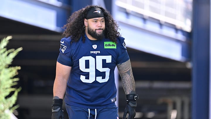 Jul 23, 2025; Foxborough, MA, USA; New England Patriots defensive tackle Khyiris Tonga (95)  walks to the practice field for training camp at Gillette Stadium. Mandatory Credit: Eric Canha-Imagn Images
