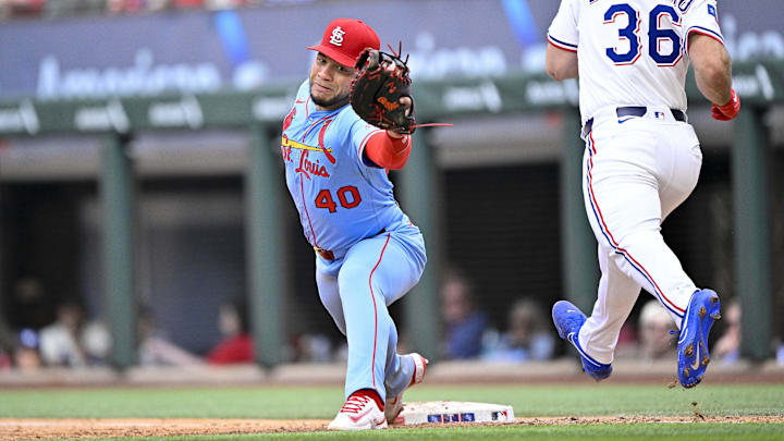 Arlington, Texas, USA; St. Louis Cardinals first baseman Willson Contreras (40) catches a throw to first base and puts out Texas Rangers center fielder Wyatt Langford (36) during the ninth inning at Globe Life Field.