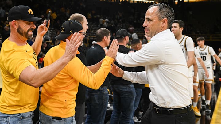 Nov 7, 2025; Iowa City, Iowa, USA; Iowa Hawkeyes head coach Ben McCollum reacts with fans after the game against the Western Illinois Leathernecks at Carver-Hawkeye Arena. Mandatory Credit: Jeffrey Becker-Imagn Images Nov 7, 2025; Iowa City, Iowa, USA; Iowa Hawkeyes head coach Ben McCollum reacts with fans after the game against the Western Illinois Leathernecks at Carver-Hawkeye Arena. Mandatory Credit: Jeffrey Becker-Imagn Images