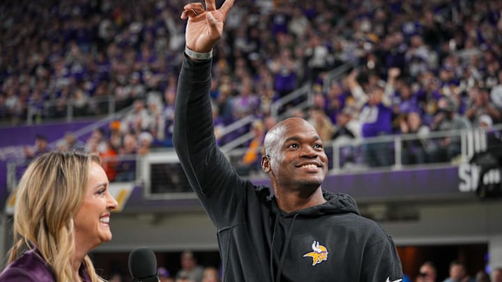 Nov 27, 2023; Minneapolis, Minnesota, USA; Ex Minnesota Viking Adrian Peterson salutes the crowd in the third quarter in a game against the Chicago Bears at U.S. Bank Stadium. Mandatory Credit: Brad Rempel-Imagn Images