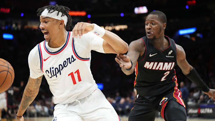 Mar 12, 2025; Miami, Florida, USA; LA Clippers guard Jordan Miller (11) saves the ball from going out of bounds in front of Miami Heat guard Terry Rozier (2) during the second half at Kaseya Center. Mandatory Credit: Jim Rassol-Imagn Images Mar 12, 2025; Miami, Florida, USA; LA Clippers guard Jordan Miller (11) saves the ball from going out of bounds in front of Miami Heat guard Terry Rozier (2) during the second half at Kaseya Center. Mandatory Credit: Jim Rassol-Imagn Images