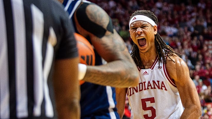 Indiana's Malik Reneau (5) flexes after dunking over Chattanooga's Frank Champion (5) during the Indiana versus Chattanooga men's basketball game at Simon Skjodt Assembly Hall on Saturday, Dec. 21, 2204.