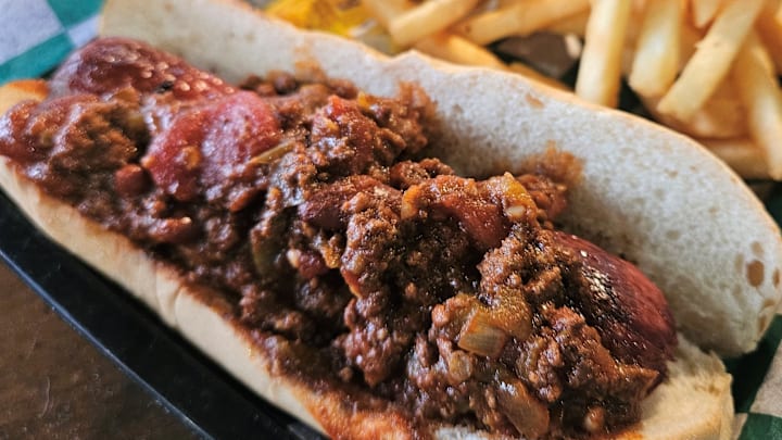 The Pub Hot Dog topped with homemade chili at The Bridge Tender Inn & Dockside Bar on Anna Maria Island photographed June 30, 2024.