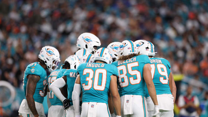 The Miami Dolphins huddle during the second quarter against the Baltimore Ravens at Hard Rock Stadium. Mandatory Credit: Nathan Ray Seebeck-Imagn Images