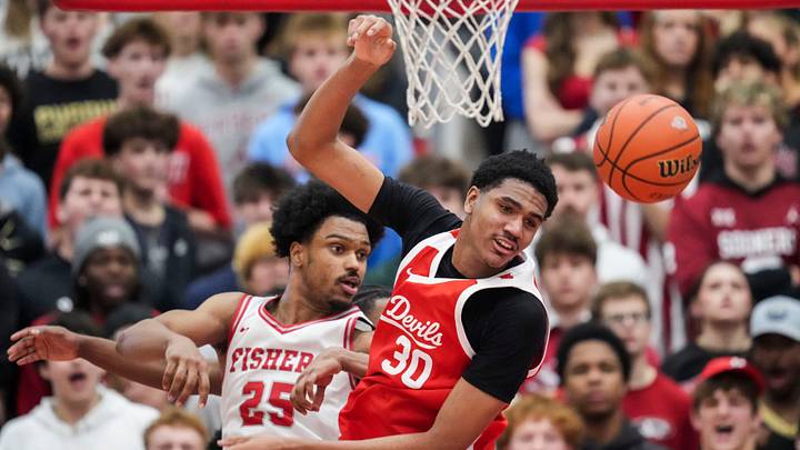 Fishers Tigers forward Kai McGrew (25) and Pike Red Devils Isaiah Hill (30) watch the ball. Fishers Tigers forward Kai McGrew (25) and Pike Red Devils Isaiah Hill (30) watch the ball.