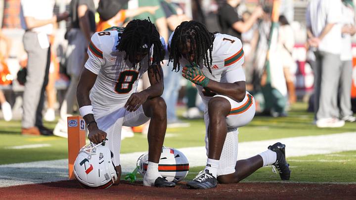 Sep 4, 2026; Stanford, California, USA; Miami Hurricanes wide receiver Vandrevius Jacobs (8) and
wide receiver Malachi Toney (1) take a knee in the endzone prior to kick off against the Stanford Cardinal at Stanford Stadium. Mandatory Credit: Stan Szeto-Imagn Images Sep 4, 2026; Stanford, California, USA; Miami Hurricanes wide receiver Vandrevius Jacobs (8) and
wide receiver Malachi Toney (1) take a knee in the endzone prior to kick off against the Stanford Cardinal at Stanford Stadium. Mandatory Credit: Stan Szeto-Imagn Images