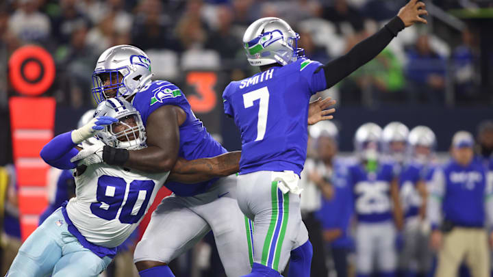 Dallas Cowboys defensive end DeMarcus Lawrence (90) pressures Seattle Seahawks quarterback Geno Smith (7).