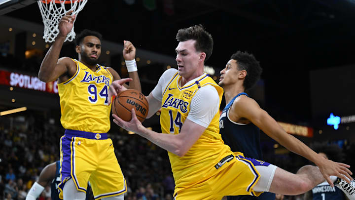 Oct 4, 2024; Palm Desert, California, USA; Los Angeles Lakers center Colin Castleton (14) gains possession against against the Minnesota Timberwolves during the second half at Acrisure Arena. Mandatory Credit: Jonathan Hui-Imagn Images Oct 4, 2024; Palm Desert, California, USA; Los Angeles Lakers center Colin Castleton (14) gains possession against against the Minnesota Timberwolves during the second half at Acrisure Arena. Mandatory Credit: Jonathan Hui-Imagn Images