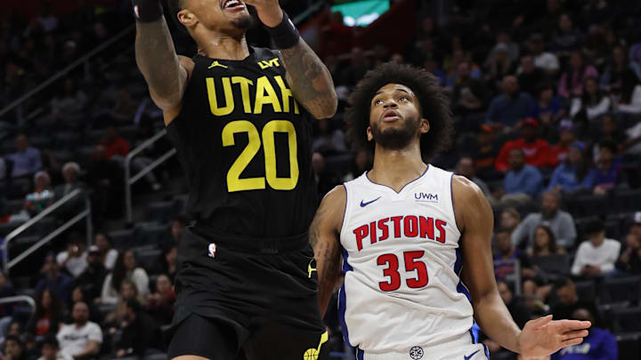 Dec 21, 2023; Detroit, Michigan, USA;  Utah Jazz forward John Collins (20) shoots on Detroit Pistons Marvin Bagley III