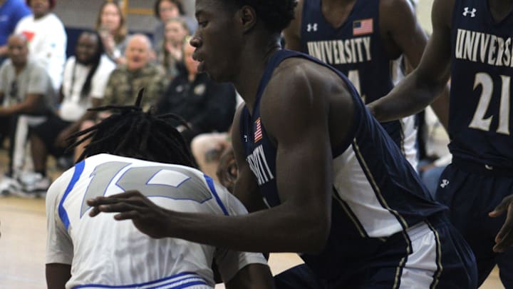 Impact Christian forward Sterling Moody (10) and University Christian center Adalbert Allotey (4) battle for possession during an FHSAA District 3-2A high school boys basketball final on February 10, 2024. [Clayton Freeman/Florida Times-Union]