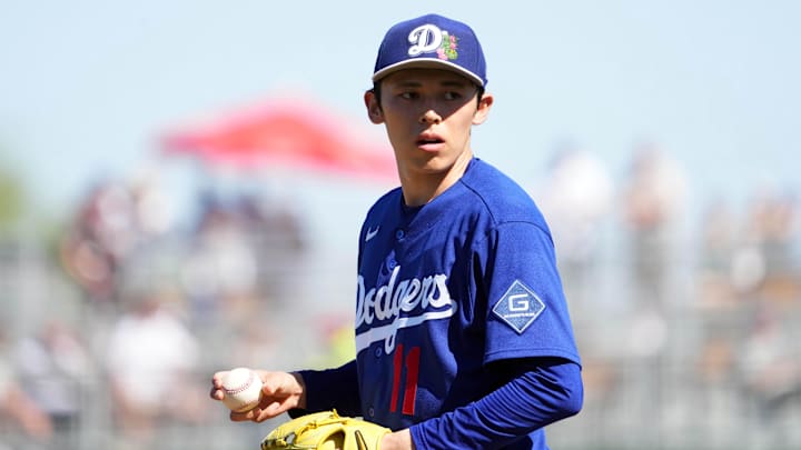 Mar 3, 2026; Goodyear, Arizona, USA; Los Angeles Dodgers starting pitcher Roki Sasaki (11) pitches against the Cleveland Guardians during the third inning at Goodyear Ballpark. Mandatory Credit: Joe Camporeale-Imagn Images
