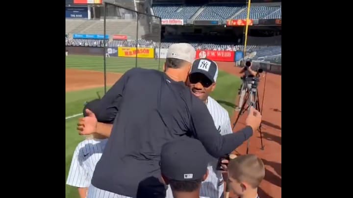Aaron Judge greets Russell Wilson ahead of the New York Yankees game against the New York Mets on Sunday. 