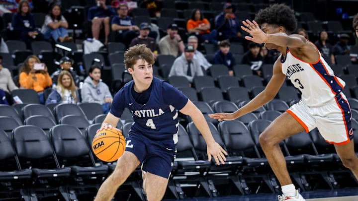 Loyola's Quincy Watson drives to the hoop against Chaminade at the Intuit Dome.