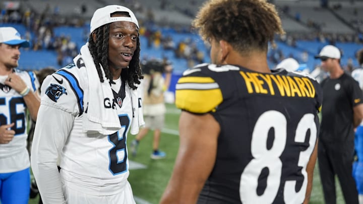 Aug 21, 2025; Charlotte, North Carolina, USA; Carolina Panthers cornerback Jaycee Horn (8) talks with Pittsburgh Steelers tight end Connor Heyward (83) after the second half at Bank of America Stadium. 