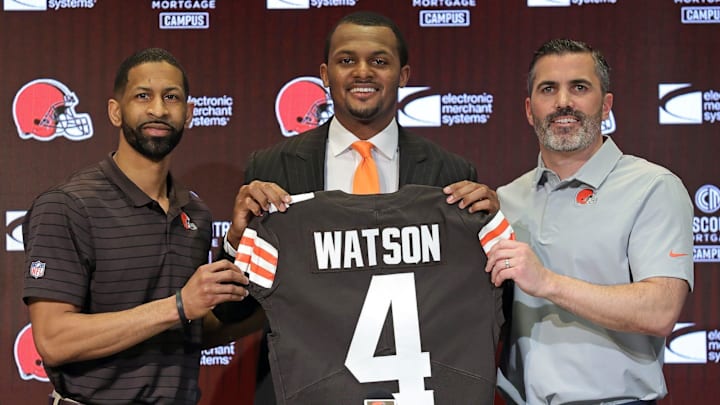 Cleveland Browns quarterback Deshaun Watson, center, poses for a portrait with general manager Andrew Berry, left, and coach Kevin Stefanski during Watson's introductory news conference on March 26, 2022, at the Browns training facility in Berea.