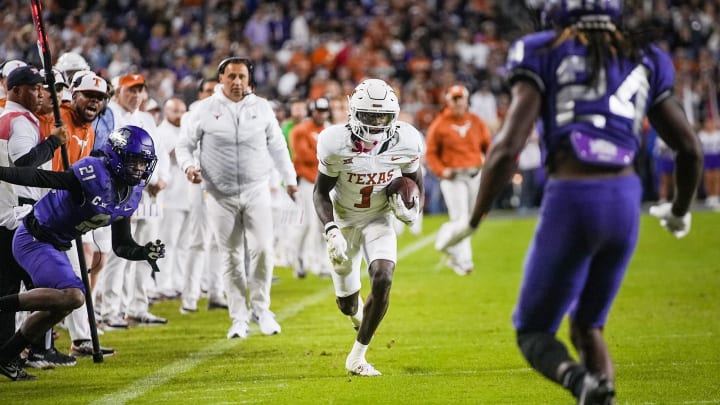 Texas Longhorns wide receiver Xavier Worthy (1) runs for the first down against TCU Horned Frogs. Texas Longhorns wide receiver Xavier Worthy (1) runs for the first down against TCU Horned Frogs.
