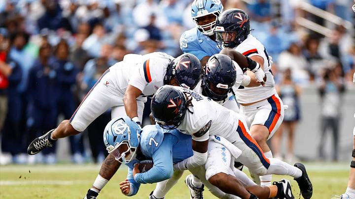 Virginia sacks North Carolina quarterback Gio Lopez (7) Oct. 25, 2025 at Kenan Memorial Stadium in Chapel Hill, N.C.