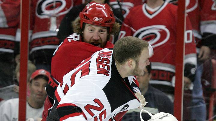 May 6, 2006; Raleigh, NC, USA; Carolina Hurricanes defenseman (22) Mike Commodore and the New Jersey Devils right wing (25) Cam Janssen fight during the 3rd period at the RBC Center.  Mandatory Credit: James Guillory-USA TODAY Sports Copyright (c) 2006 James Guillory