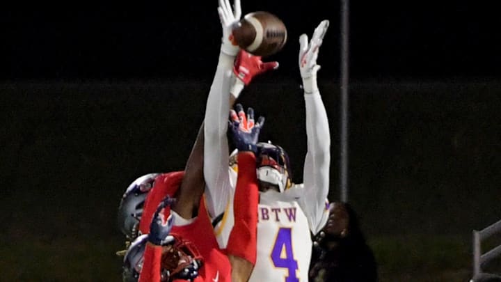 Pike Road's James Caver (2) helps break up a pass intended foir Booker T. Washington's Marquez Daniel (4)during their game in Pike Road , Ala., on Friday November 3, 2023.
