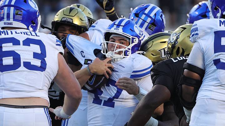 Oct 24, 2026; Orlando, Florida, USA; Brigham Young Cougars quarterback Bear Bachmeier (47) is tackled during the fourth quarteragainst the Central Florida Knights at Acrisure Bounce House. Mandatory Credit: Mike Watters-Imagn Images Oct 24, 2026; Orlando, Florida, USA; Brigham Young Cougars quarterback Bear Bachmeier (47) is tackled during the fourth quarteragainst the Central Florida Knights at Acrisure Bounce House. Mandatory Credit: Mike Watters-Imagn Images