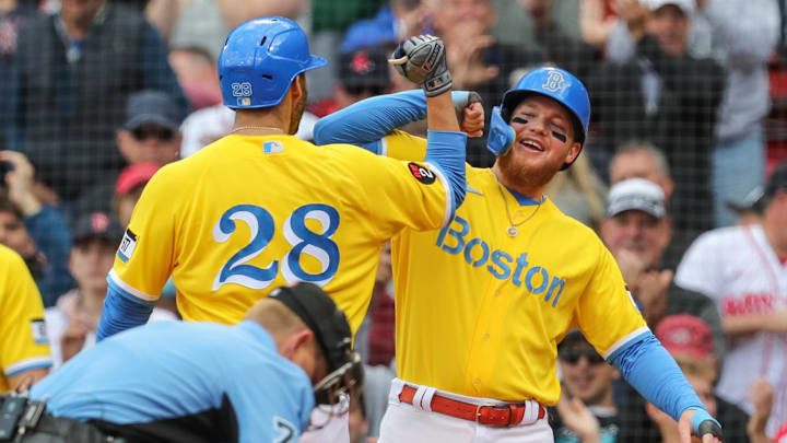 Sep 29, 2022; Boston, Massachusetts, USA; Boston Red Sox designated hitter JD Martinez (28) celebrates with Boston Red Sox right fielder Alex Verdugo (99) after hitting a two run home run during the eighth inning against the Baltimore Orioles at Fenway Park. Mandatory Credit: Paul Rutherford-Imagn Images