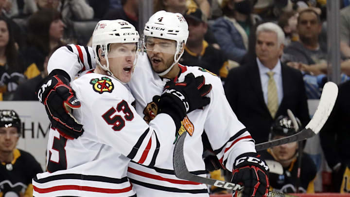 Chicago Blackhawks forward Buddy Robinson celebrates with Seth Jones after scoring against the Pittsburgh Penguins.