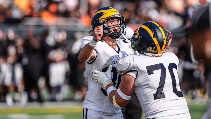 Clarkston RB Griffin Boman, left, had one of the best runs of the year in the playoffs last Friday against Lake Orion.