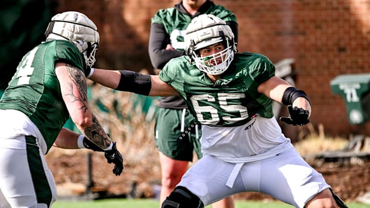 Michigan State offensive lineman Stanton Ramil, right, and Gavin Broscious work out during football practice on Tuesday, April 8, 2025, in East Lansing. Michigan State offensive lineman Stanton Ramil, right, and Gavin Broscious work out during football practice on Tuesday, April 8, 2025, in East Lansing.