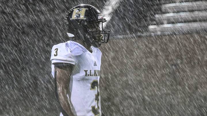 T.L. Hanna senior JJ Hudson(3) stands in pouring rain, waiting for a kickoff during the first quarter of the Class AAAAA State championship at Benedict College in Columbia, S.C. T.L. Hanna senior JJ Hudson(3) stands in pouring rain, waiting for a kickoff during the first quarter of the Class AAAAA State championship at Benedict College in Columbia, S.C.