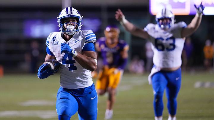 Sep 20, 2025; Greenville, North Carolina, USA;  Brigham Young Cougars running back LJ Martin (4) runs for a touchdown against the East Carolina Pirates during the second half at Dowdy-Ficklen Stadium. Mandatory Credit: James Guillory-Imagn Images