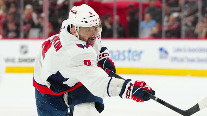May 10, 2025; Raleigh, North Carolina, USA; Washington Capitals left wing Alex Ovechkin (8) takes a shot against the Carolina Hurricanes during the second period in game three of the second round of the 2025 Stanley Cup Playoffs at Lenovo Center. Mandatory Credit: James Guillory-Imagn Images
