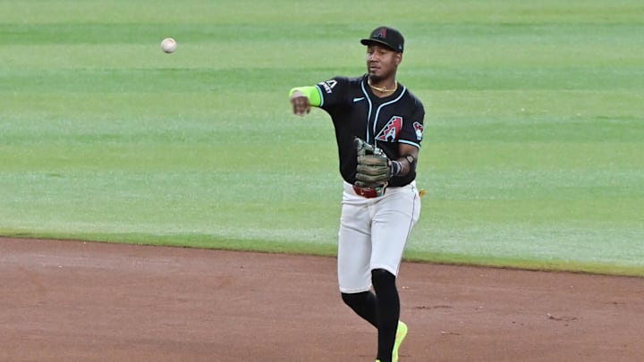 Sep 23, 2024; Phoenix, Arizona, USA;  Arizona Diamondbacks shortstop Geraldo Perdomo (2) throws to first in the seventh inning against the San Francisco Giants at Chase Field. Mandatory Credit: Matt Kartozian-Imagn Images