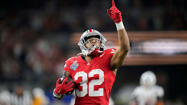 Ohio State Buckeyes running back TreVeyon Henderson (32) scores a touchdown on a 75-yard touchdown catch and run against Texas Longhorns in the second quarter of the Cotton Bowl Classic during the College Football Playoff semifinal game at AT&T Stadium in Arlington, Texas on January, 10, 2025. Ohio State Buckeyes running back TreVeyon Henderson (32) scores a touchdown on a 75-yard touchdown catch and run against Texas Longhorns in the second quarter of the Cotton Bowl Classic during the College Football Playoff semifinal game at AT&T Stadium in Arlington, Texas on January, 10, 2025.