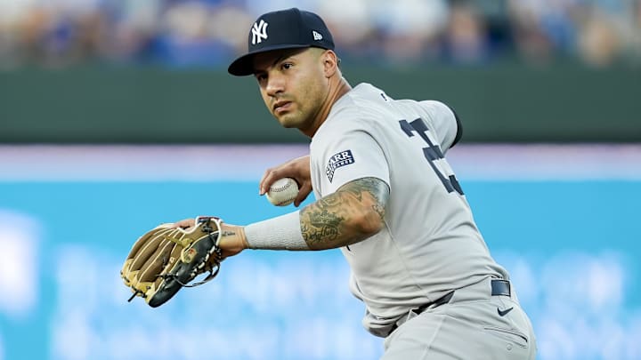 Oct 9, 2024; Kansas City, Missouri, USA; New York Yankees second base Gleyber Torres (25) throws to first base during the first inning against the Kansas City Royals in game three of the ALDS for the 2024 MLB Playoffs at Kauffman Stadium. Mandatory Credit: Jay Biggerstaff-Imagn Images
