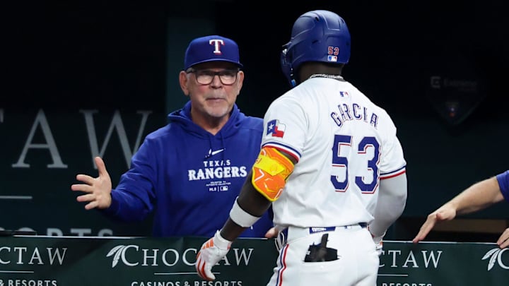 Sep 18, 2024; Arlington, Texas, USA;  Texas Rangers right fielder Adolis Garcia (53) celebrates with Texas Rangers manager Bruce Bochy (15) after hitting a two-run home run during the sixth inning against the Toronto Blue Jays at Globe Life Field.