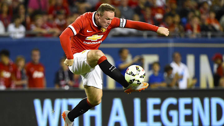 Jul 29, 2015; Chicago, IL, USA; Manchester United forward Wayne Rooney (10) kicks the ball against the Paris Saint-Germain during the second half at Soldier Field. Paris Saint-Germain defeats Manchester United 2-0. Mandatory Credit: Mike DiNovo-Imagn Images