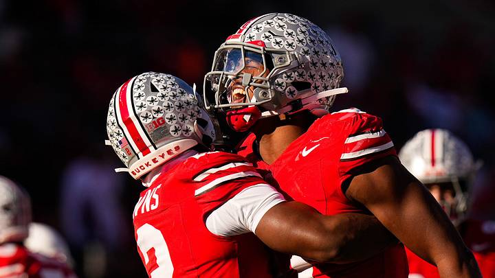 Ohio State Buckeyes stars Caleb Downs and Sonny Styles celebrate after sacking Rutgers Scarlet Knights quarterback Athan Kaliakmanis